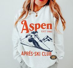 Après Ski Sweatshirt" is the perfect cozy addition for those post-slope gatherings or winter festivities. Whether you're at a ski resort, a mountain getaway, or a bachelorette party in Aspen, this sweatshirt brings style and warmth. Ideal for ski-themed parties, camp bachelorette weekends, or simply lounging by the fireplace after a day in the snow, it's a must-have for any winter adventure. Embrace the fun of the season with this stylish après-ski sweater that captures the spirit of snowy mount Apres Ski Sweater, Ski Sweatshirt, Ski Mountain, Ski Club, Mountain Getaway, Ski Sweater, Winter Adventure, Bachelorette Weekend, Apres Ski