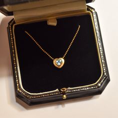 A lovely Italian 18k aquamarine heart pendant necklace. A great gift for a loved one this holiday season. Features a heart-shaped aquamarine stone bezel set in a solid gold heart pendant suspended from a ball chain necklace. The pendant is strung through two whole in the top of the heart and the necklace secures with a standard spring-ring clasp.  The necklace is hallmarked '750' on a metal tag attached to the clasp and the gold has been acid tested for authenticity. We believe the stone is most Fine Jewelry Heart Necklace With Birthstone For Formal Occasions, Gold Aquamarine Jewelry With Bezel Setting, Heart Cut Blue Topaz Jewelry For Gift, Heart Cut Blue Topaz Jewelry Gift, Blue Topaz Heart Pendant Necklace As Gift, Blue Topaz Heart Pendant Necklace For Gift, Yellow Gold Gemstone Heart Necklace For Anniversary, Anniversary Yellow Gold Heart Necklace With Gemstone, Luxury Blue Topaz Necklaces For Anniversary