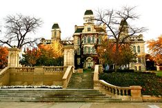 an old mansion with steps leading up to it