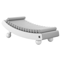 a white bed with wheels on the bottom and one foot resting on it's side