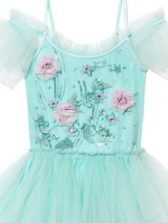 Embark on a journey of enchantment with the Floating Florals Tutu Dress in Teal Gloss. Its off-the-shoulder neckline, paired with adjustable straps, offers the perfect fit. The bodice is adorned with meticulously hand-applied flowers crafted from delicate tulle, each featuring a sparkling crystal center. This exquisite detail infuses the teal-colored dress with an aura of allure and charm. Perfect for any special occasion, let your little one dazzle and delight in this captivating ensemble that Floating Florals, Tulle Tutu, Net Fabric, Dress 16, Sparkling Crystal, Tutu Dress, Dress Making, Woven Fabric, Knitted Fabric