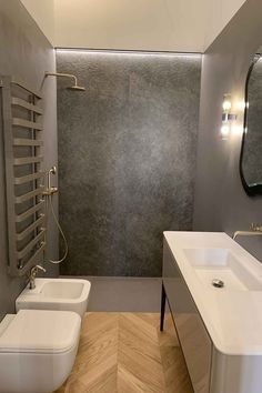 a modern bathroom with two sinks and a shower