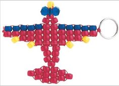 a red and blue beaded airplane keychain with yellow balls on the front