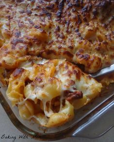 a casserole dish with cheese and meat on it, ready to be eaten