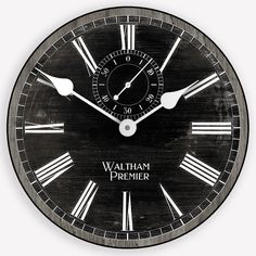 a black clock with roman numerals and the words walt primer on it