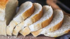 sliced bread sitting on top of a cutting board