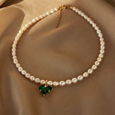 This elegant necklace made of natural pearls will be a beautiful accent to your look. The pendant with a deep green crystal looks unique in combination with the classic pearls. Choose this choker and look stunning. Materials: Natural freshwater pearls. Heart pendant: cubic zirconia and brass. Pendant size: 1,4cm*1,4cm. Fittings: brass. Length 40см (+5cm). 🔸more from us🔸 https://www.etsy.com/shop/DoraJewelryAccessory Green Stone Pendant, Romantic Woman, Woman Jewelry, Necklace Elegant, Pendant Choker, Jewelry Accessories Ideas, Elegant Necklace, Jewelry Christmas, Green Crystal