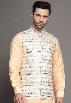 Art Silk Nehru Jacket in Light BeigeThis Readymade Sleeveless attire is Enhanced with Buttons, Mirror Effect and Resham Work. Crafted in Chinese Collar NeckDo note: Brooch and Kurta shown in the image is for presentation purposes only. Half to one inch may vary in measurement. (Slight variation in actual color vs. image is possible) Mens Kurta | Mens Kurta Pajama | Mens Sherwani | Mens Sherwani Sets | Traditional Menswear | Partywear Menswear | Indian Mens Dresses | Diwali Kurta | Kurta Pajama | Festive Beige Nehru Jacket With Zari Work, Beige Nehru Jacket For Festive Transitional Season, Festive Beige Nehru Jacket For Festivals, Beige Nehru Jacket With Zari Work For Diwali, Festive Beige Nehru Jacket With Embroidery, Beige Long-sleeved Nehru Jacket For Festivals, Beige Long Sleeve Nehru Jacket For Festivals, Designer Embroidered Multicolor Nehru Jacket, Spring Bollywood Nehru Jacket With Intricate Embroidery