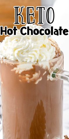 a hot chocolate drink with whipped cream on top and the words keto hot chocolate above it