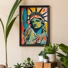 there is a statue of liberty on the wall next to some plants and potted plants