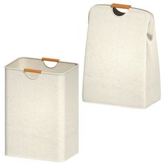 two white storage bins with handles on each side and one holding a brown handle