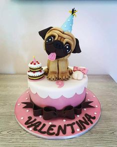 a birthday cake with a pug on top