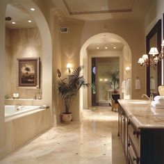 a large bathroom with marble floors and walls