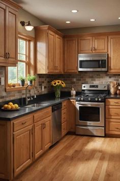 a kitchen with wooden cabinets and stainless steel appliances in the center, along with wood flooring