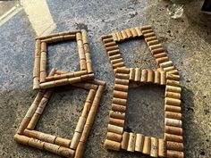 two frames made out of wine corks sitting on the ground next to each other