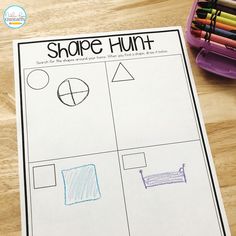 a piece of paper that says shape hunt with pencils and markers next to it