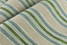 the fabric is striped with green and blue stripes