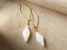 With soft shades of cloudy white, faceted moonstones hang from our Kira Earrings, complemented by 22kt gold-vermeil. Sky Jewelry, Petaluma California, Gold Earring, Square Earrings, Threader Earrings, Beads And Wire, Jewelry Inspo, Stylish Jewelry, Moon Stone