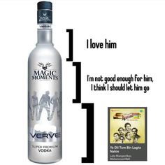 a bottle of vodka sitting next to an advertise