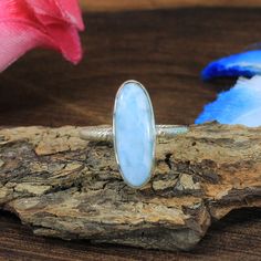 Larimar Silver Ring - Rope Band Ring - Gemstone Silver Ring - Handmade Ring - Larimar Gemstone Ring - Larimar Jewelry - Blue Gemstone Ring 》D E T A I L S《 ✦Gemstone : Natural Larimar ✦Metal : 925 Sterling Silver ✦Gemstone Size : 20 x 7 MM Approx ✦Weight : 4.37 Gram Approx ❣❣ Handmade Item ❣❣ **This ring is Made to Order** 》G EM S T O N E D E T A I L《 **Gemstone structure may vary from the image as two gemstones do not have the same structure** If you want to see the picture of gemstone, then fee Oval Larimar Gemstone Rings, Oval Moonstone Larimar Ring, Garnet Stone Ring, Blue Gemstone Ring, Blue Gemstone Rings, Larimar Ring, Larimar Jewelry, Ring Gifts, Promise Ring Gift