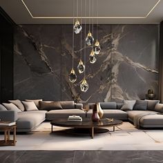 a modern living room with marble walls and grey couches, chandelier and coffee table