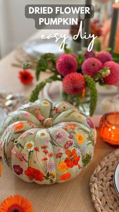 the table is decorated with flowers and pumpkins