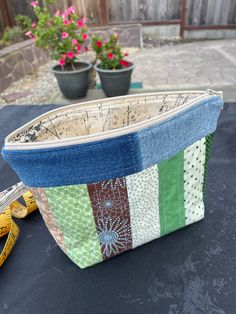 a patchwork purse sitting on top of a table