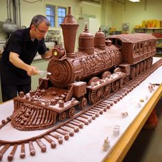 a man working on a train made out of chocolate