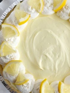 a pie with lemons and meringue on top is ready to be eaten