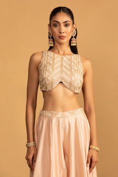 Peach blouse with gota work embroidery and pearl, shells tassels. Paired with coordinating palazzo and dupatta. - Aza Fashions Traditional Tops With Pearl Embroidery For Designer Wear, Elegant Sleeveless Choli With Pearl Embroidery, Traditional Sleeveless Blouse With Pearl Embroidery, Festive Sleeveless Blouse With Pearl Embroidery, Sleeveless Choli With Pearl Embroidery For Festive Occasion, Traditional Sleeveless Top With Pearl Embroidery, Festive Sleeveless Top With Pearl Embroidery, Festive Sleeveless Pearl Embroidered Choli, Festive Sleeveless Pearl Embroidery Choli