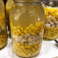 several jars filled with food sitting on top of a table