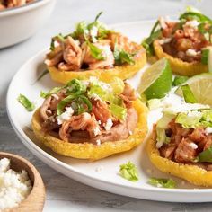 small appetizers with meat, lettuce and sauce on a white plate