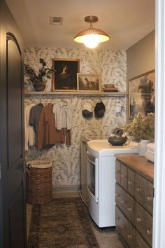 a laundry room with an old fashioned washer and dryer in the corner next to it