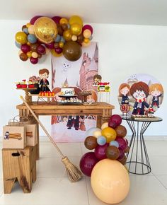 a table with balloons and decorations on it