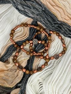 This beautiful set highlights copper tones and pairs well with other natural stone jewelry. This set includes the 3 bracelets shown, all are stretchy and made to fit the majority. Highlights Copper, Copper Penny, Natural Stone Jewelry, Stone Jewelry, The 3, Natural Stone, Natural Stones, Penny, Swirl