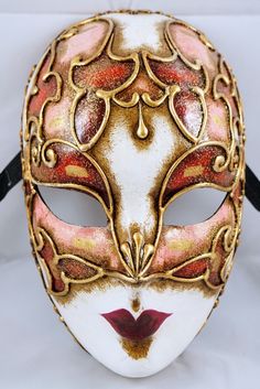 Our masks are made according to the oldest Venetian techniques and with the most innovative materials in the sector. Each mask is a unique craftsmanship that comes directly to your home, created and customized just for you. With this mask you will impress everyone at any dance or costume party. 🎭 🎃 The mask is unisex and one size fits all. 👩🏽 👨🏼 It is made from hypoallergenic and certified materials. ✅ Only manufactured in Italy. 🇮🇹 What are you waiting for to order it? You can also requ Venetian Full Face Halloween Mask, Fantasy Masks For Carnival And Festivals, Venetian Full Face Mask For Halloween, Fantasy Carnival Mask For Festivals, Full Face Venetian Halloween Mask, Artistic Red Masks And Prosthetics For Costume Party, Venetian Mask For Mardi Gras, Artistic Masks For Festivals And Costume Parties, Artistic Masks For Costume Party And Festivals