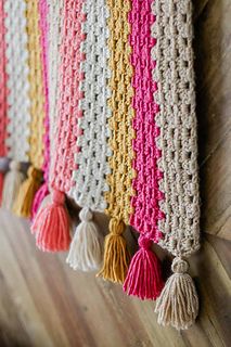 crocheted wall hangings with tassels on the side and text that says modern crochet afghan