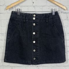 Saltwater Luxe Mini Skirt Women Small Washed Black Denim Button Fly Academia Y2k -Quality: New With Tags No Signs Of Wear Or Trying -Style Profile: 90's School Dark Academia -If It's Any Measurement They Are Located In The Pictures. Please Compare The Measurement Photos To Your Favorite Garments To Ensure Fit. -We Do Our Best To Describe Accurately Measure Approximately At The Time Of Listing. -100% Authenticity Guaranteed Due To Our Knowledge And Research. -Items Typically Ship Same Or Next Bus Summer Black Skirt With Button Closure, Trendy Mid-rise Mini Skirt With Button Closure, Black High Rise Bottoms With Snap Buttons, Black Bottoms With Snap Buttons For Spring, Black Button-up Summer Skirt, Black Denim Bottoms With Button Zip Fly, Trendy Dark Wash Skirt With Button Zip Fly, Casual Black Button-up Bottoms, Casual High Waist Mini Skirt With Button Zip Fly