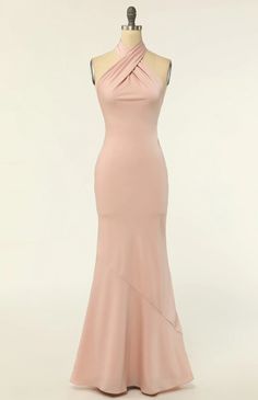 a dress on a mannequin with a halter neckline and long skirt