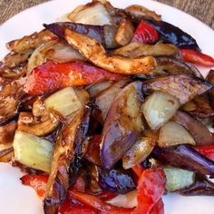 a white plate topped with sliced up vegetables