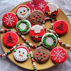 decorated cookies are arranged on a platter