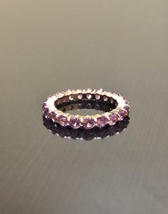 DeKara Designs Custom Metal- 18K Rose Gold, .750. Stones- 18 Plus Round Pink Sapphires, 3.0 MM. 3.00-Carats. Number of sapphires and carat weight depends on your finger size. Size- 4-12. Please allow 3-5 working days for me to complete and ship out your eternity band. Band will be started on as soon as transaction has been processed. Handmade Beautiful Pink Sapphire Eternity Band Made in 18K Rose Gold. There are over 18 round pink sapphires which are all prong set with perfection. The sapphires Wedding Band Sapphire, Modern Diamond Rings, Sapphire Eternity Band, Tiffany Engagement Ring, Gold Diamond Wedding Rings, Sapphire Wedding Band, Sapphire Band, Engagement Band, Sapphire Wedding