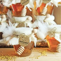 jars filled with honey sitting on top of a table