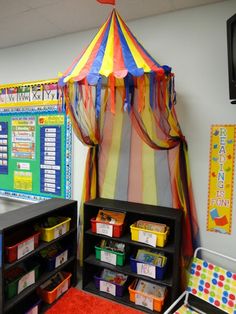 a classroom with a tent and toys in it