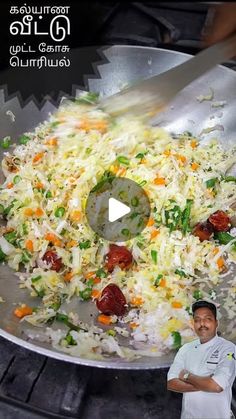 a man standing in front of a frying pan filled with rice and veggies