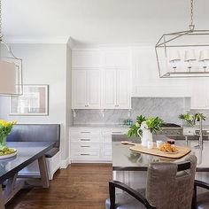 the kitchen is clean and ready to be used as a dining room or breakfast nook