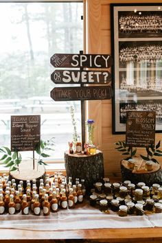 an assortment of food and drinks displayed on a table in front of a sign that says spicy or sweet?