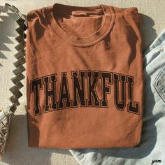 Trendy Oversized Fall and Halloween Tee with a perfect thankful print you will absolutely love! TRUE TO SIZE but could size up 2 sizes for the super oversized look...otherwise go with your true to size. COMFORT COLORS TEE! True to size. (unisex sizing). 100% Combed ring-spun cotton. Soft Washed Garment Dyed Unisex Sizing Retro Thanksgiving, Thankful Shirt, Thanksgiving Tee, Halloween Top, Oversized Look, Pumpkin Season, Comfort Colors Tee, Halloween Tees, Fall Vibes