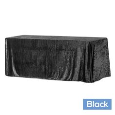 a black table cloth on top of a white backdrop with the word black written below it