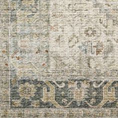 an old rug with faded colors and designs on the carpet is shown in this close up photo